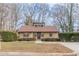 Traditional-style home with neat landscaping, windows, and a driveway at 3847 Admiral Dr, Chamblee, GA 30341