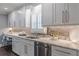 Modern kitchen with stainless steel appliances, granite countertops, and white cabinets at 3847 Admiral Dr, Chamblee, GA 30341