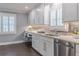Bright kitchen with stainless steel appliances, granite countertops, and white cabinets at 3847 Admiral Dr, Chamblee, GA 30341