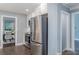 Updated kitchen features stainless steel appliances and view into adjacent dining area at 3847 Admiral Dr, Chamblee, GA 30341