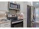 Updated kitchen with stainless steel appliances, granite countertops, and stylish backsplash at 3847 Admiral Dr, Chamblee, GA 30341