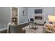 Cozy living room showcasing a modern fireplace, seating, and open dining access at 3847 Admiral Dr, Chamblee, GA 30341