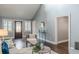 Bright living room with hardwood floors, white trim, and a decorative front door at 3847 Admiral Dr, Chamblee, GA 30341