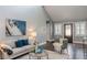 Inviting living room featuring a vaulted ceiling, hardwood floors, and stylish decor at 3847 Admiral Dr, Chamblee, GA 30341