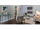 Living area with a fireplace, stylish furniture, and sleek hardwood floors at 3847 Admiral Dr, Chamblee, GA 30341