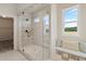 Bathroom features a large walk in shower with glass enclosure and built in bench at 3850 Ivy Cottage Se Dr, Snellville, GA 30039