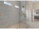 Large walk-in shower with glass enclosure and marble tile at 3850 Ivy Cottage Se Dr, Snellville, GA 30039
