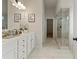Bathroom with double vanity, white cabinets, and a large walk-in shower at 3850 Ivy Cottage Se Dr, Snellville, GA 30039