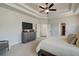Main bedroom with large TV, dresser, and access to the bathroom and closet at 3850 Ivy Cottage Se Dr, Snellville, GA 30039