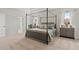 Main bedroom with a canopy bed, a sitting area and plenty of natural light at 3850 Ivy Cottage Se Dr, Snellville, GA 30039