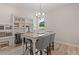 Formal dining room boasts granite top table and built-in shelving at 3850 Ivy Cottage Se Dr, Snellville, GA 30039