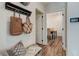 Entryway with bench, coat hooks and view into dining area at 3850 Ivy Cottage Se Dr, Snellville, GA 30039