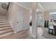 Spacious foyer with hardwood floors and a staircase leading upstairs at 3850 Ivy Cottage Se Dr, Snellville, GA 30039