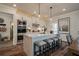 Modern kitchen with white cabinets, large island, and stainless steel appliances at 3850 Ivy Cottage Se Dr, Snellville, GA 30039