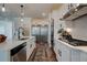 Modern kitchen with white cabinets, stainless steel appliances, and a large island at 3850 Ivy Cottage Se Dr, Snellville, GA 30039