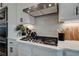 Modern kitchen with gas cooktop and geometric backsplash tile at 3850 Ivy Cottage Se Dr, Snellville, GA 30039