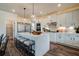 Elegant kitchen features a large island with seating and stainless steel appliances at 3850 Ivy Cottage Se Dr, Snellville, GA 30039