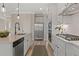 Stylish kitchen features stainless steel appliances and white cabinetry at 3850 Ivy Cottage Se Dr, Snellville, GA 30039