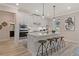 Open concept kitchen with island and stainless steel appliances at 3850 Ivy Cottage Se Dr, Snellville, GA 30039
