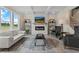 Spacious living room features a cozy fireplace and large windows at 3850 Ivy Cottage Se Dr, Snellville, GA 30039