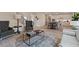 Open living room showcasing a stylish sitting area and adjacent kitchen at 3850 Ivy Cottage Se Dr, Snellville, GA 30039