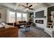 Spacious living room with a fireplace, built-ins, and hardwood floors at 3850 Ivy Cottage Se Dr, Snellville, GA 30039