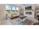 Living room with fireplace, large windows, and plenty of natural light at 3850 Ivy Cottage Se Dr, Snellville, GA 30039