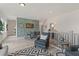 Open loft area with wood floors, seating area and game table at 3850 Ivy Cottage Se Dr, Snellville, GA 30039