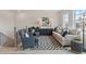 Seating area with large windows in a spacious loft at 3850 Ivy Cottage Se Dr, Snellville, GA 30039