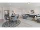 Open loft with a game table, seating area, and wood floors at 3850 Ivy Cottage Se Dr, Snellville, GA 30039