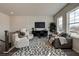 Spacious loft with seating area, large windows, and wood flooring at 3850 Ivy Cottage Se Dr, Snellville, GA 30039