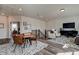 Bright and airy loft with wood floors, seating area, and dining table at 3850 Ivy Cottage Se Dr, Snellville, GA 30039