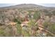 Aerial view of a home surrounded by trees in a wooded neighborhood at 5216 Old Mountain Ln, Powder Springs, GA 30127