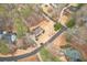 Aerial view of house surrounded by trees; corner lot at 5216 Old Mountain Ln, Powder Springs, GA 30127