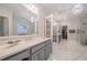 Spacious bathroom with double vanities, modern fixtures, and a glass-enclosed shower at 5216 Old Mountain Ln, Powder Springs, GA 30127