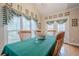 Sun-filled dining room with a large window and french doors, offering a bright and airy space at 5216 Old Mountain Ln, Powder Springs, GA 30127