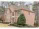 Brick home with manicured landscaping, a classic brick facade, and a decorative front door at 5216 Old Mountain Ln, Powder Springs, GA 30127