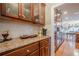 Spacious kitchen with wood cabinets, granite counters, display cabinets, and stainless appliances at 5216 Old Mountain Ln, Powder Springs, GA 30127