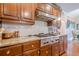 Well-equipped kitchen featuring granite countertops, stainless steel appliances, and wood cabinetry at 5216 Old Mountain Ln, Powder Springs, GA 30127