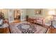 Bright living room with hardwood floors, a decorative rug, and vintage furnishings at 5216 Old Mountain Ln, Powder Springs, GA 30127