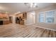Open living room area with hardwood floors and lots of natural light at 5216 Old Mountain Ln, Powder Springs, GA 30127