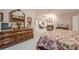 Spacious main bedroom with fireplace, offering a cozy and elegant retreat within the home at 5216 Old Mountain Ln, Powder Springs, GA 30127