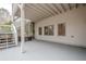 Spacious covered patio with stairs to the backyard and windows at 5216 Old Mountain Ln, Powder Springs, GA 30127
