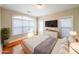 Bright bedroom with hardwood floors, large windows, a TV, and a neutral color scheme at 5430 Glenridge Vw # 1601, Sandy Springs, GA 30342