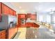 Modern kitchen featuring stainless steel appliances, dark wood cabinets, and granite countertops at 5430 Glenridge Vw # 1601, Sandy Springs, GA 30342