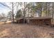 Small wooden shed and covered workshop area at 1050 Zion Church Rd, Dallas, GA 30157