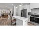 Bright kitchen with white cabinets, stainless appliances and view into dining room at 1260 Wright Se Ln, Atlanta, GA 30316