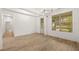 Dining room features hardwood floors, chandelier and view to the foyer at 305 Sobeck Way, Canton, GA 30115