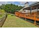 Landscaped backyard with deck, hot tub and privacy fence at 1403 Shiloh Oak Dr, Loganville, GA 30052