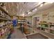Partially finished basement with shelving and workbenches at 1403 Shiloh Oak Dr, Loganville, GA 30052